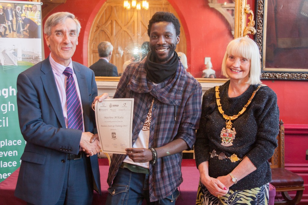 Matthew M'Kulia from Art Evolve receives his certificate from John Redwood MP
